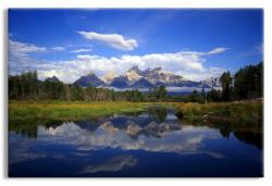 The Teton Range reflecting in the Snake River